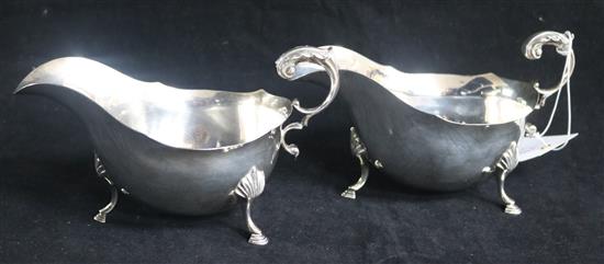 A pair of 1960s silver sauceboats with flying scroll handles. 15.5 oz.